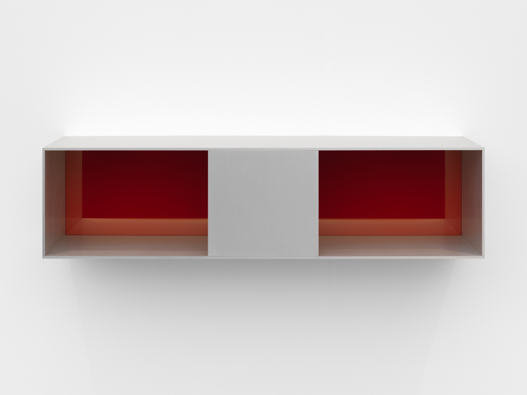 Donald Judd, Untitled, 1991. Clear anodized aluminum with yellow over red acrylic sheet,

10 x 40 x 10 inches.