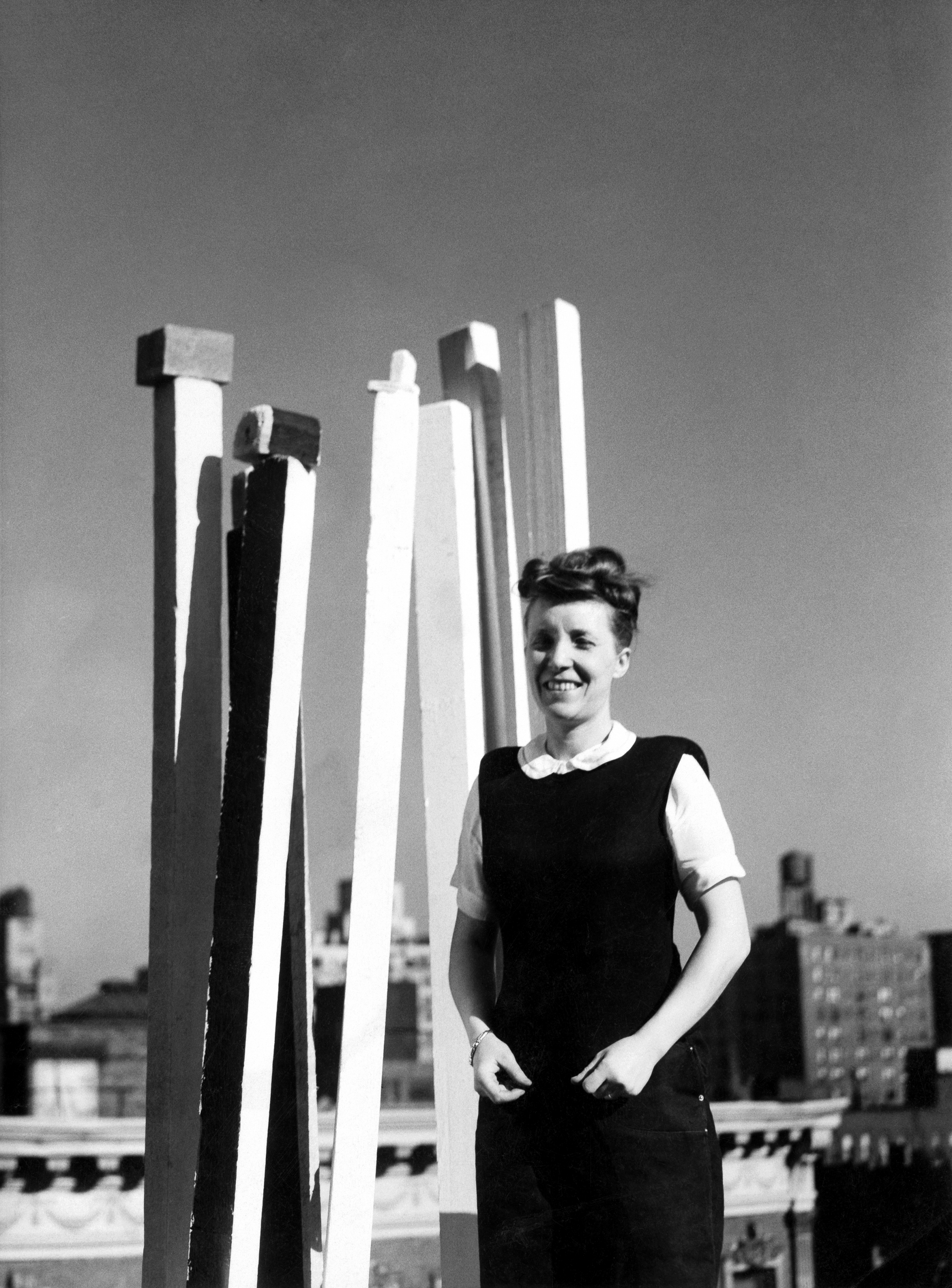 Louise Bourgeois with her sculpture on the roof of her NYC apartment building, circa 1944.

Photo: &copy; The Easton Foundation/Licensed by VAGA at ARS, NY.